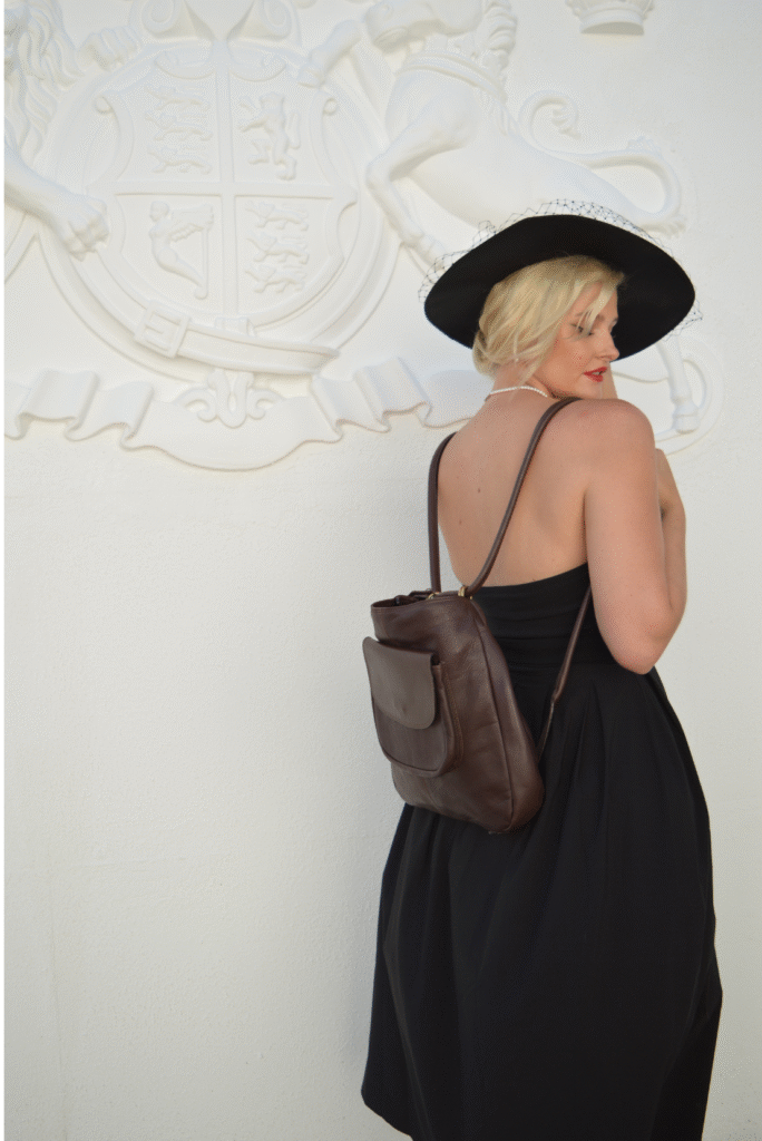 woman wearing a brown hide & seek backpack for everyday use